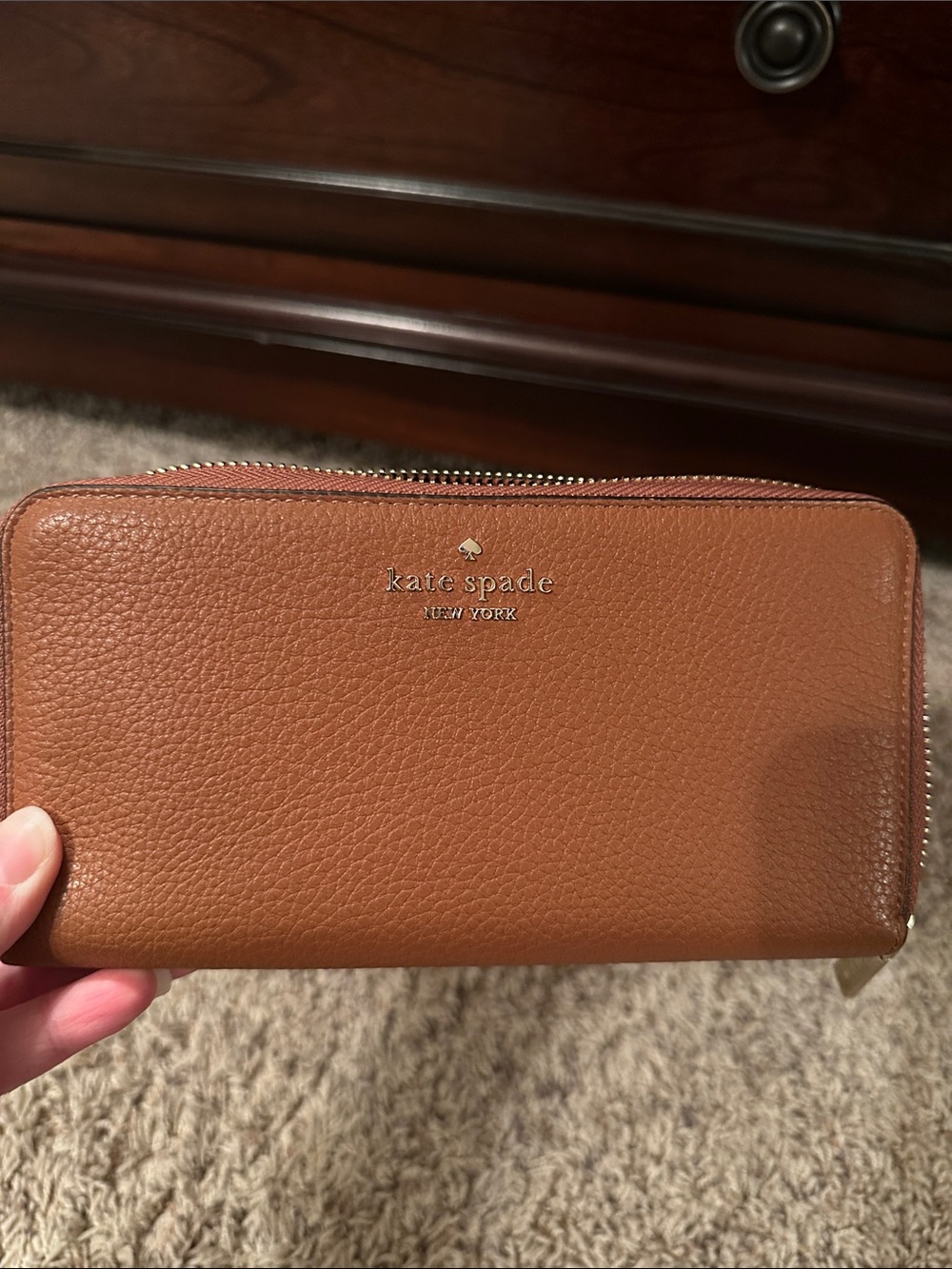 Kate Spade Leila tan pebbled leather zip-around wallet with gold logo